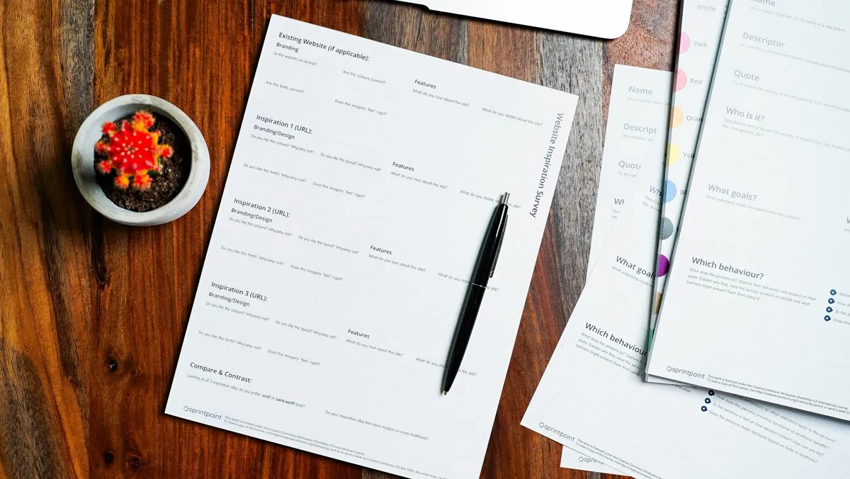 A printed assessment and a pen on a desk